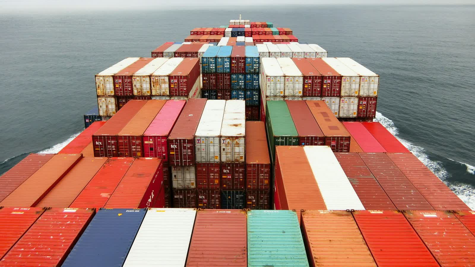 Crew working on the deck of a cargo vessel